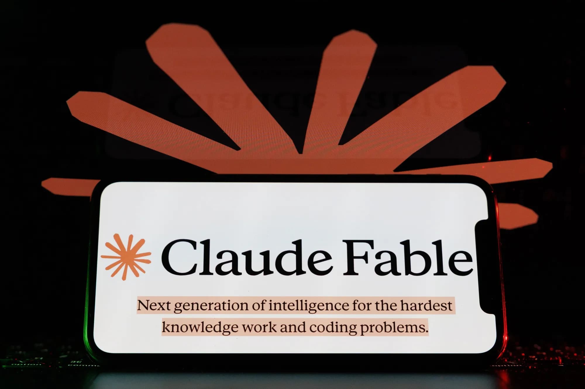 A smartphone displaying a Claude branded product screen, photographed against a dark background.