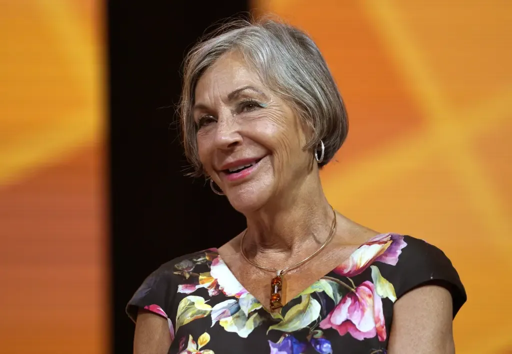 Alice Walton smiling on stage