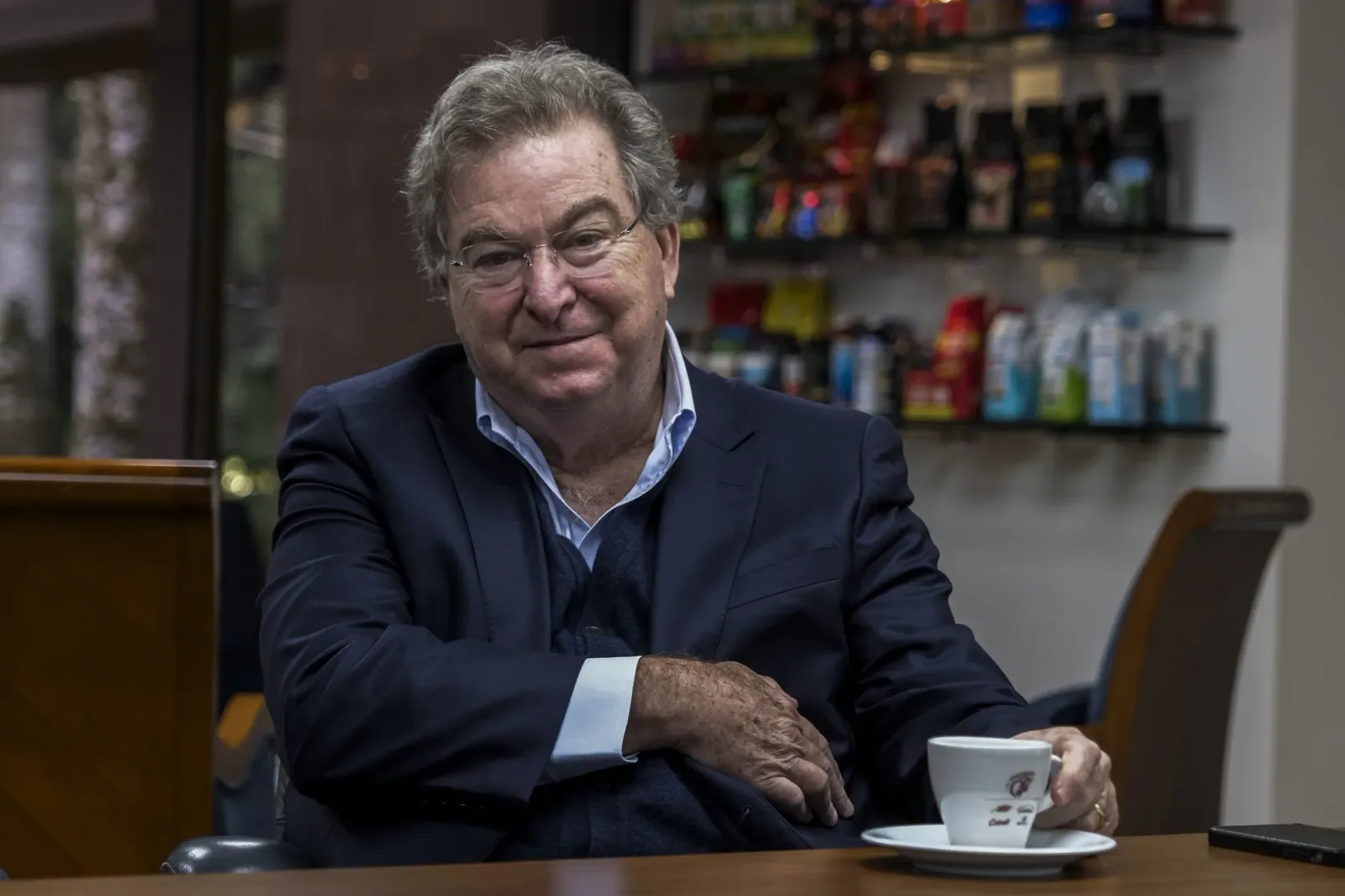 Jaime Gilinski, Colombian billionaire businessman, seated with a coffee cup