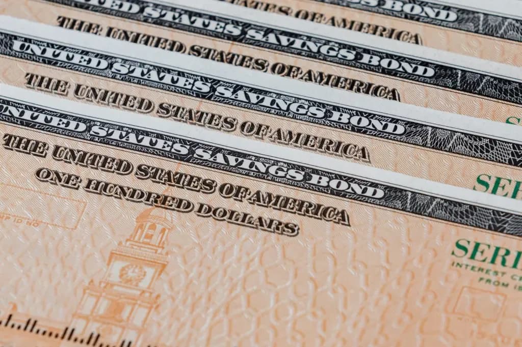 Close up of United States savings bonds fanned out in a row