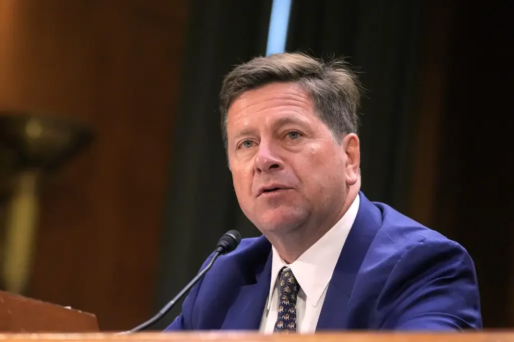 Director of National Intelligence Jay Clayton speaking at a podium